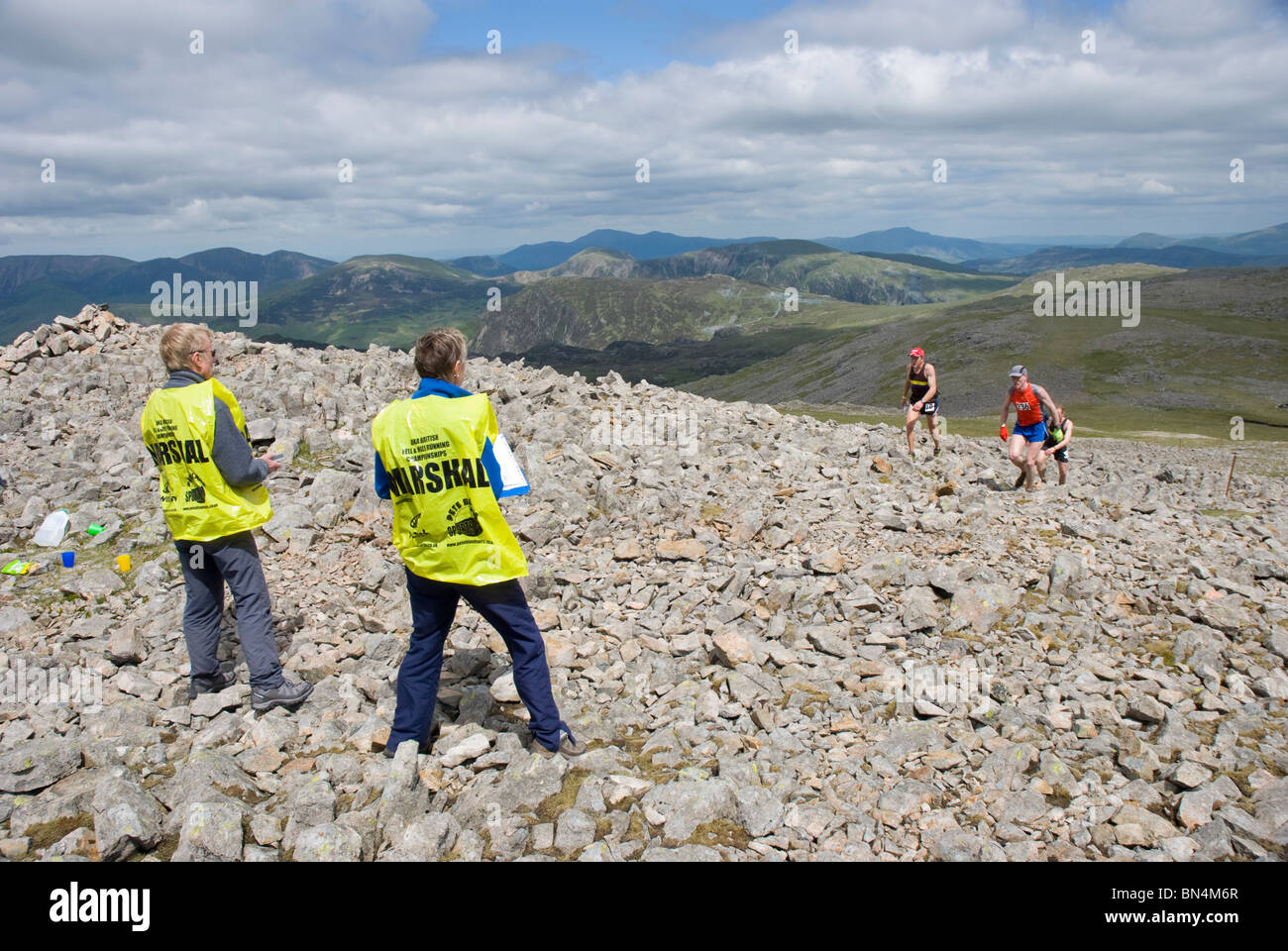 Fell runners arriving at a checkpoint on Kirk Fell, during the Ennerdale Fell Race, Lake District. Stock Photo