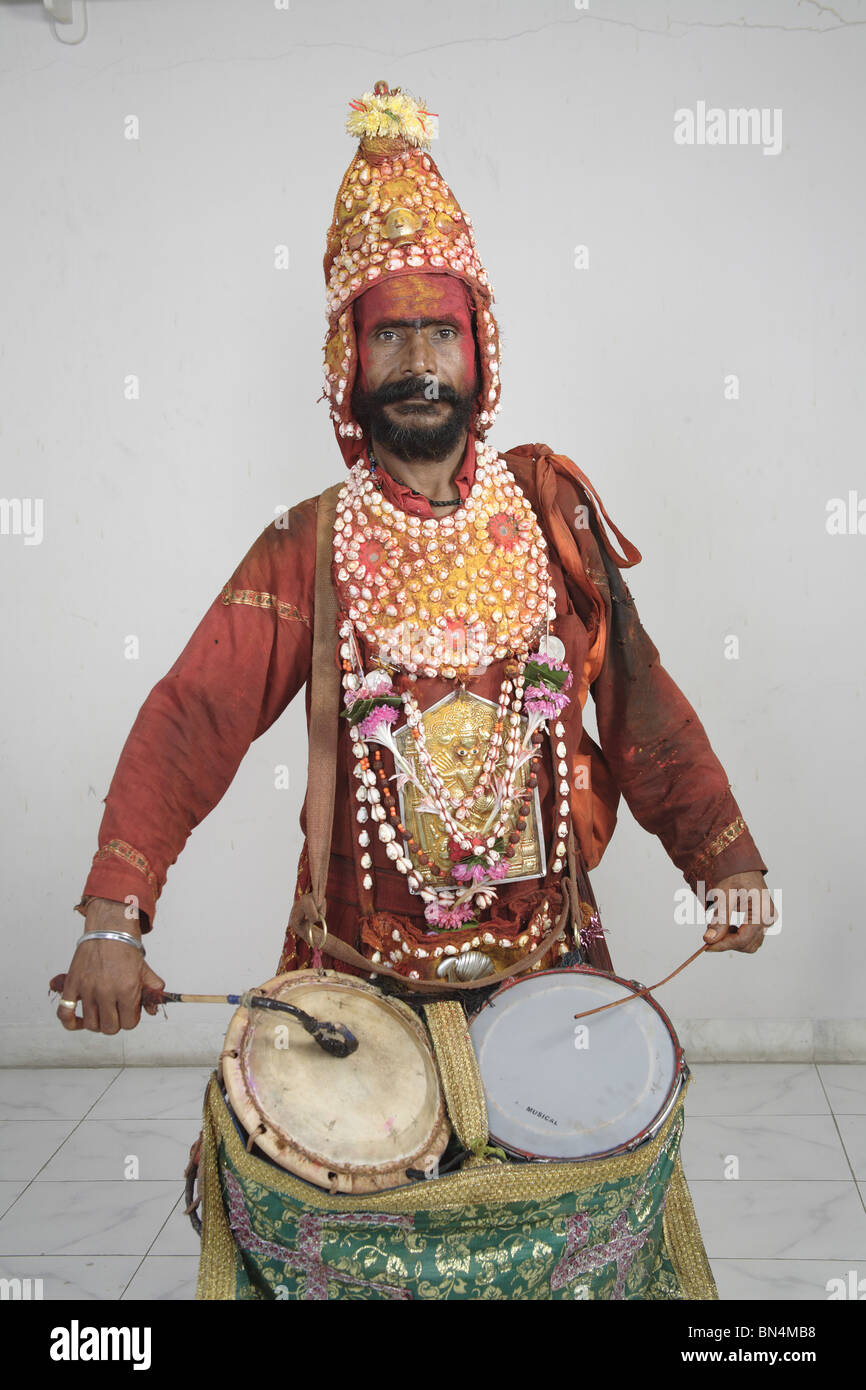 Gondhali from Solapur District  playing drums ; Maharashtra ; India MR#687Z Stock Photo