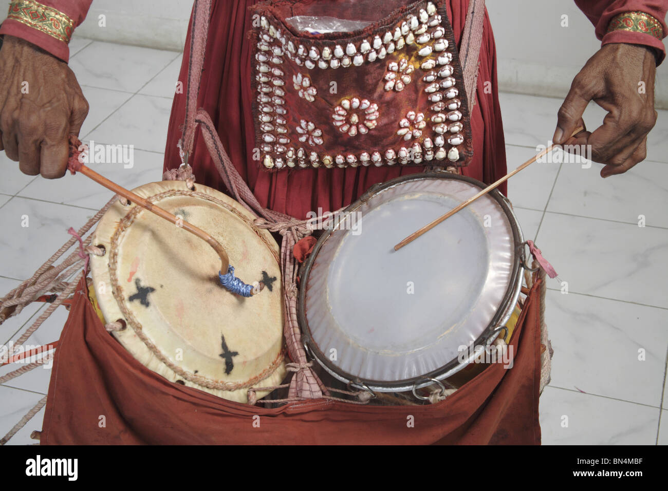 Gondhali from Solapur District  playing drums ; Maharashtra ; India Stock Photo