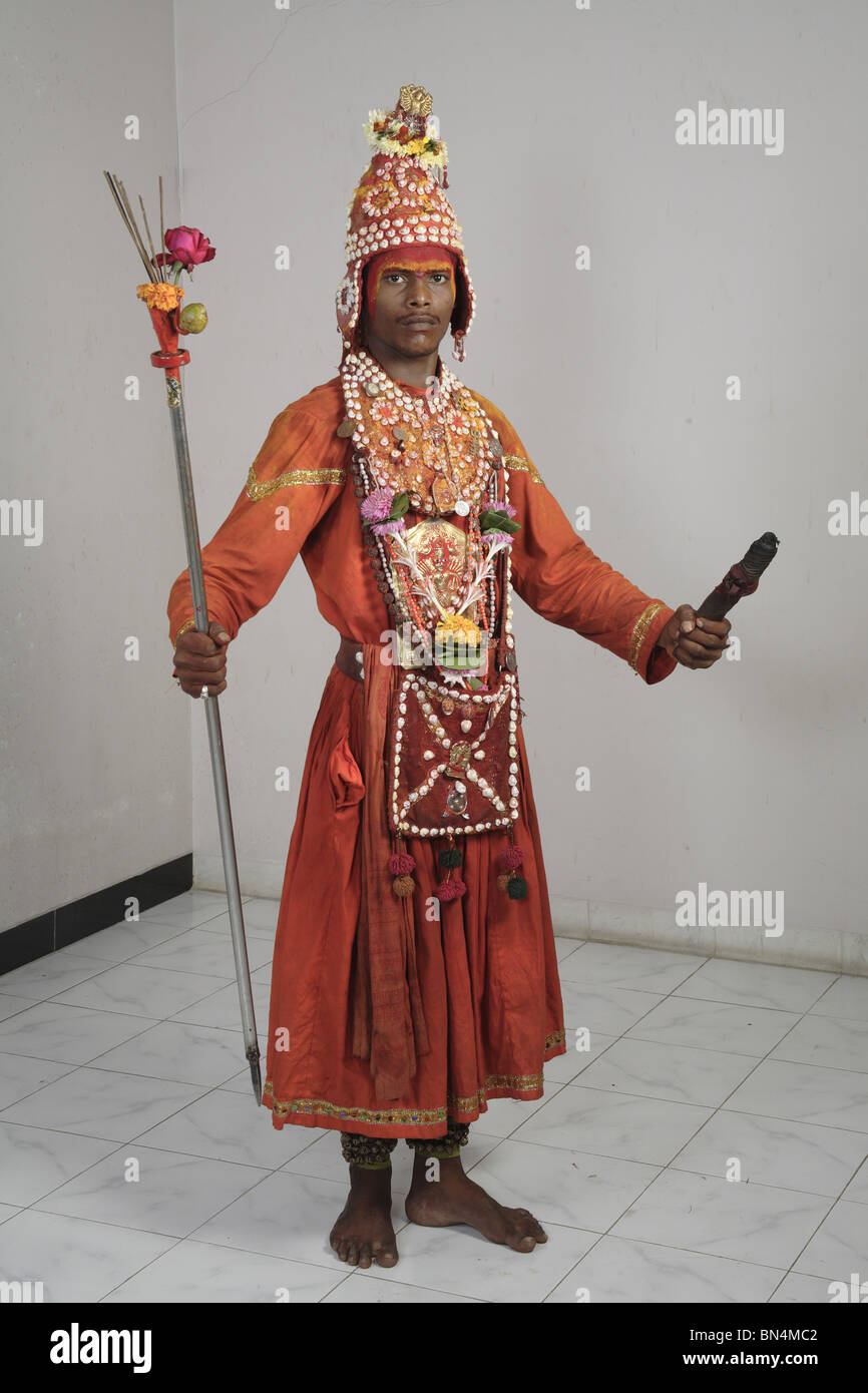 Gondhali from Solapur District  holding incense sticks ; Maharashtra ; India MR#687W Stock Photo