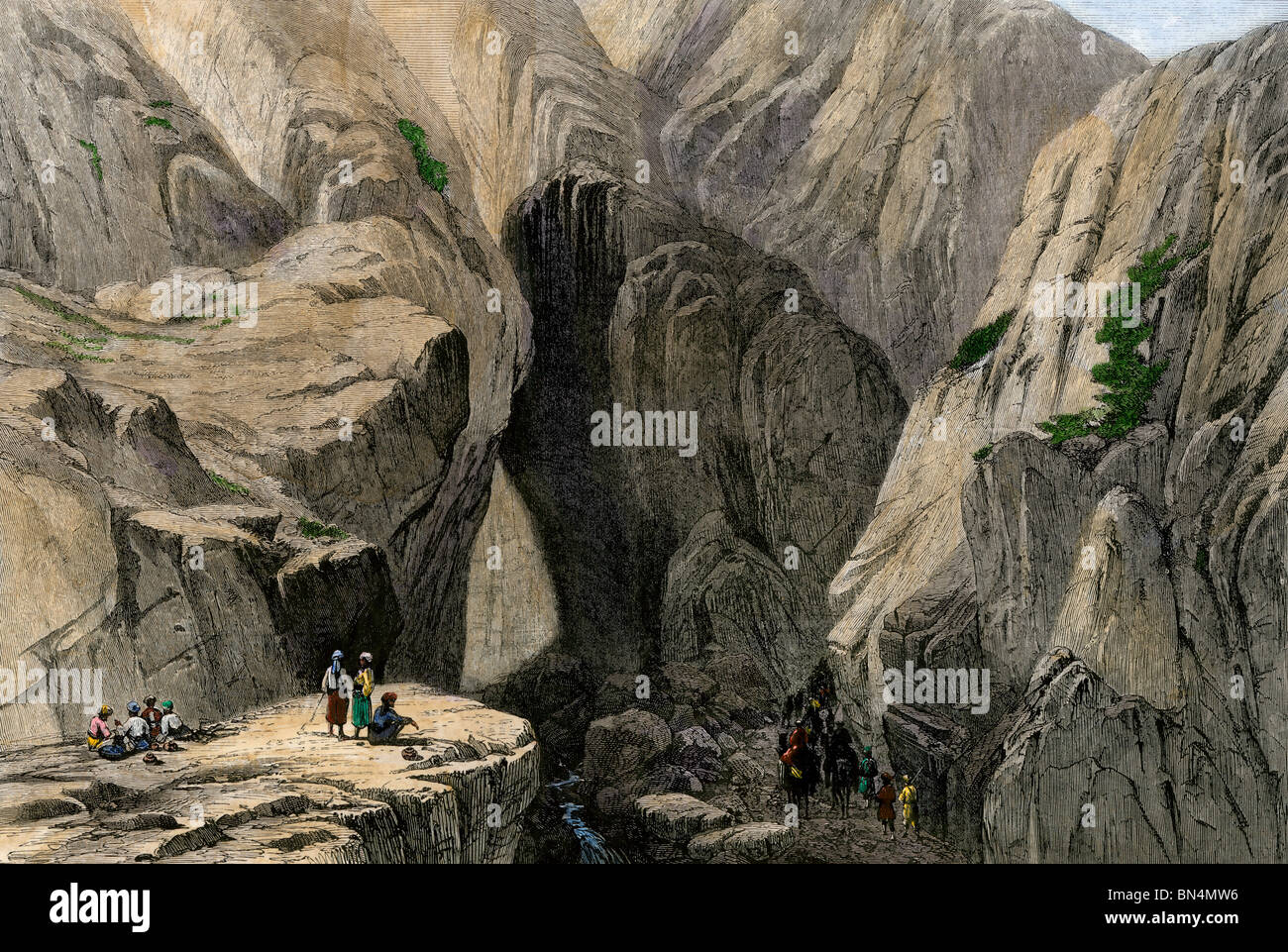 Caravan entering Khojak Pass in the Sulaiman Range, Pakistan, on the road from Kandahar, 1800s. Hand-colored woodcut Stock Photo