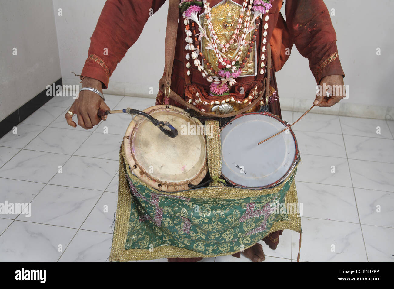 Gondhali from Solapur District  playing drums ; Maharashtra ; India Stock Photo