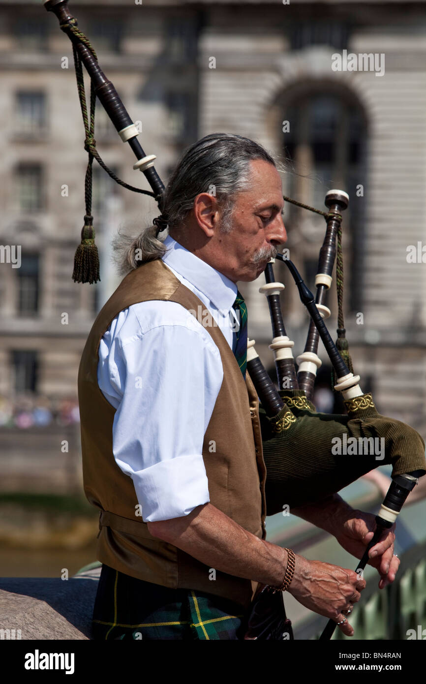 Man Playing Bagpipes, Westminster Bridge, London, England Stock Photo