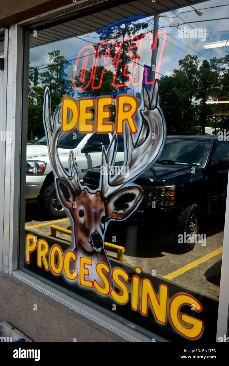 "Deer Processing" sign painted on The Sausage Link store restaurant