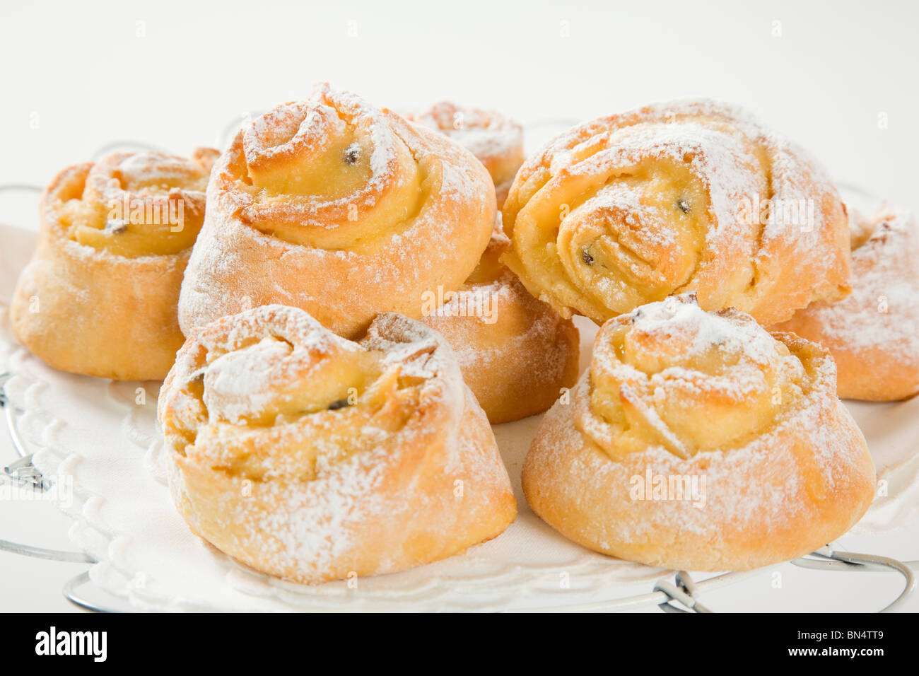 sweet Savory buns with white icing Stock Photo Alamy