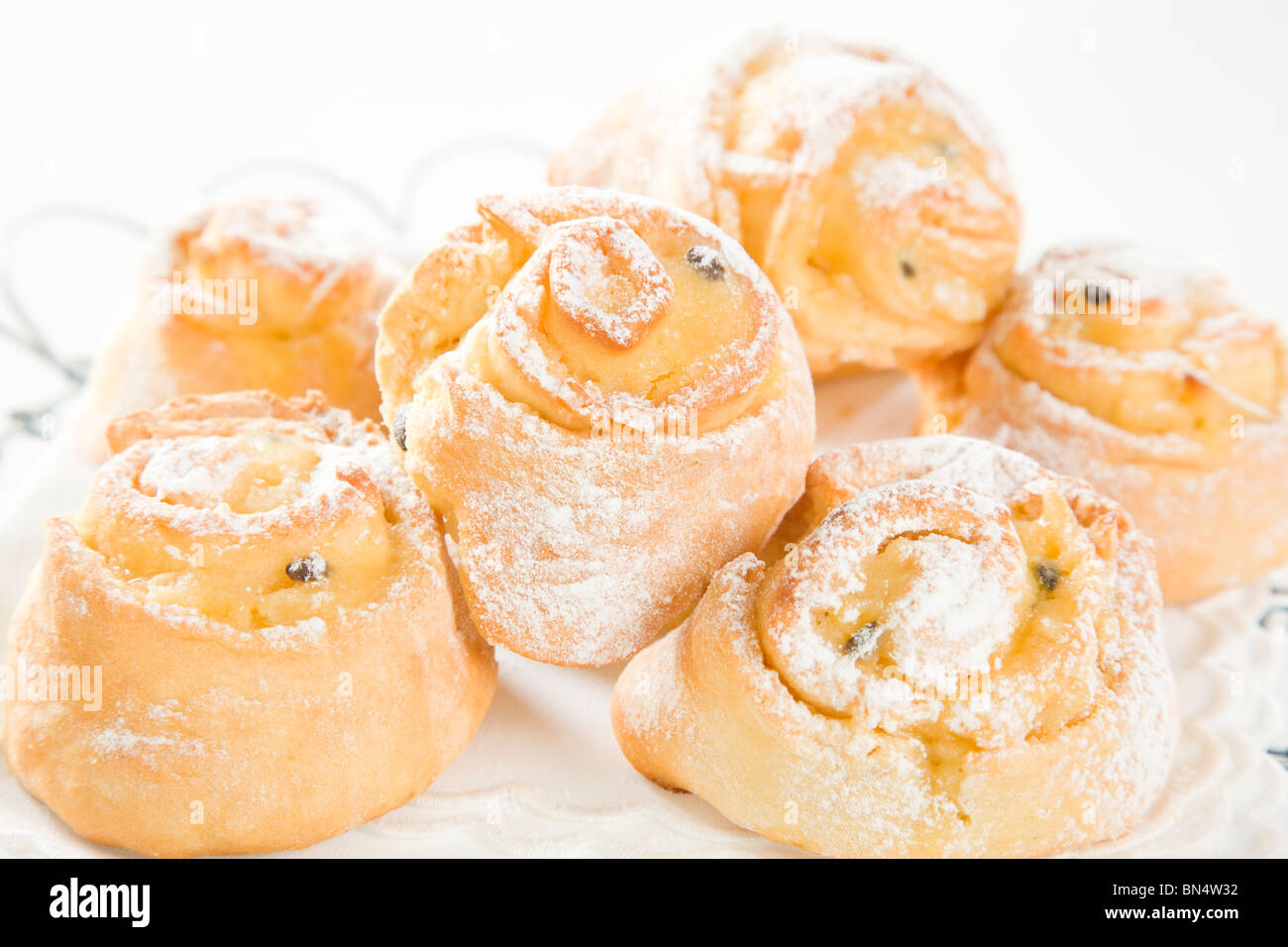 sweet Savoury buns with white icing Stock Photo Alamy