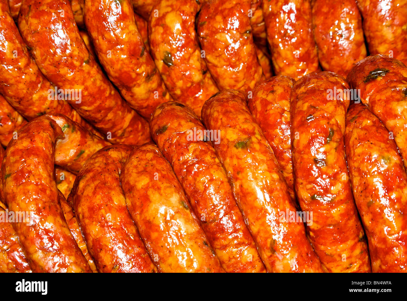 Cooked smoked boudin sausages glistening with oil at The Sausage Link factory Sulphur LA Stock Photo