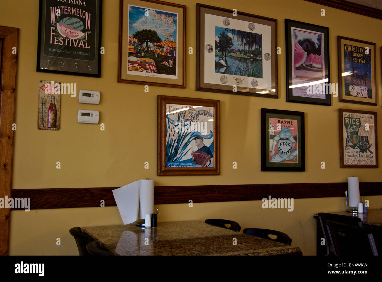Framed festival posters decorate eatery dining area at The Sausage Link