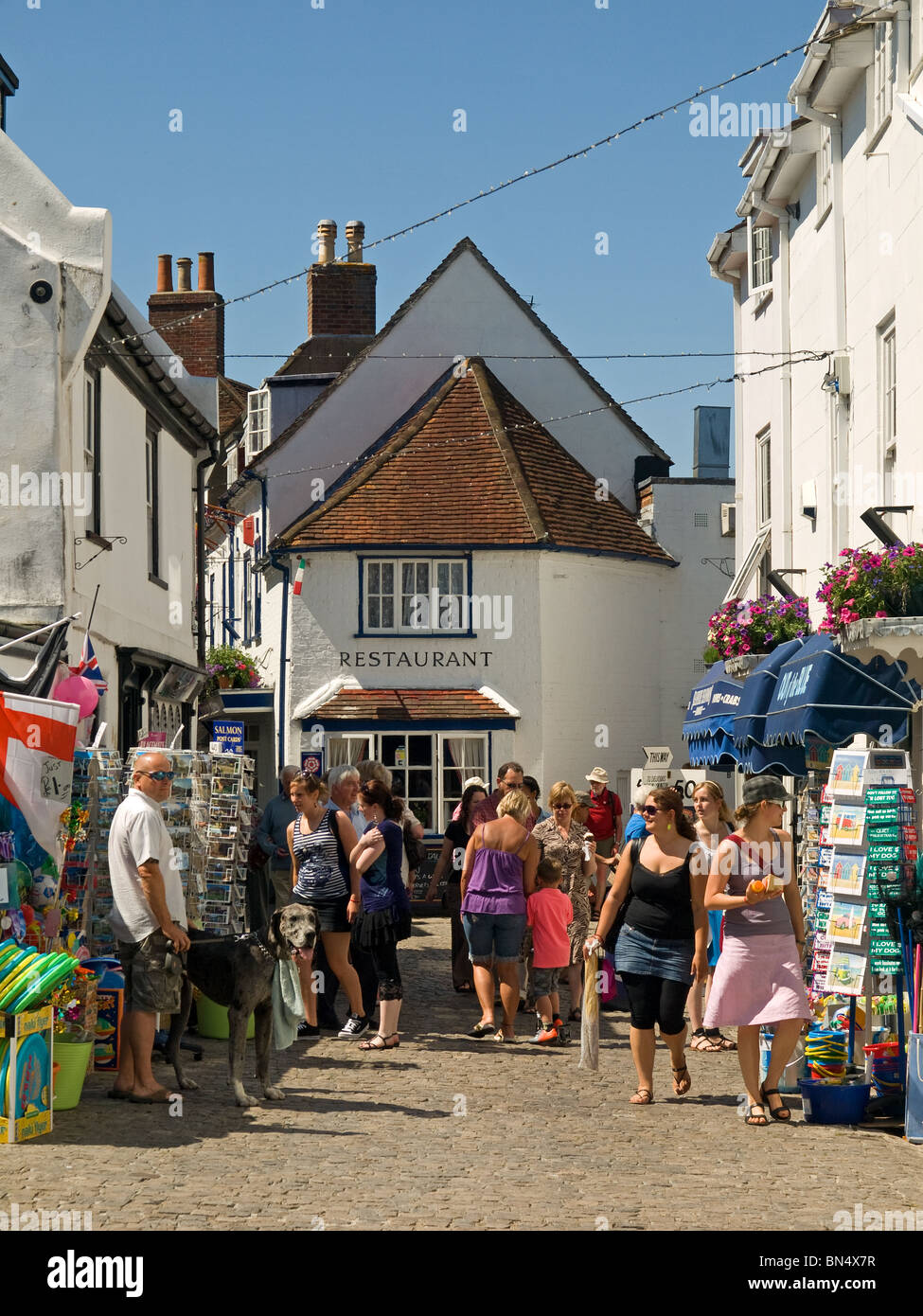 Tourists and shoppers walking along Quay Street Lymington Hampshire England UK Stock Photo