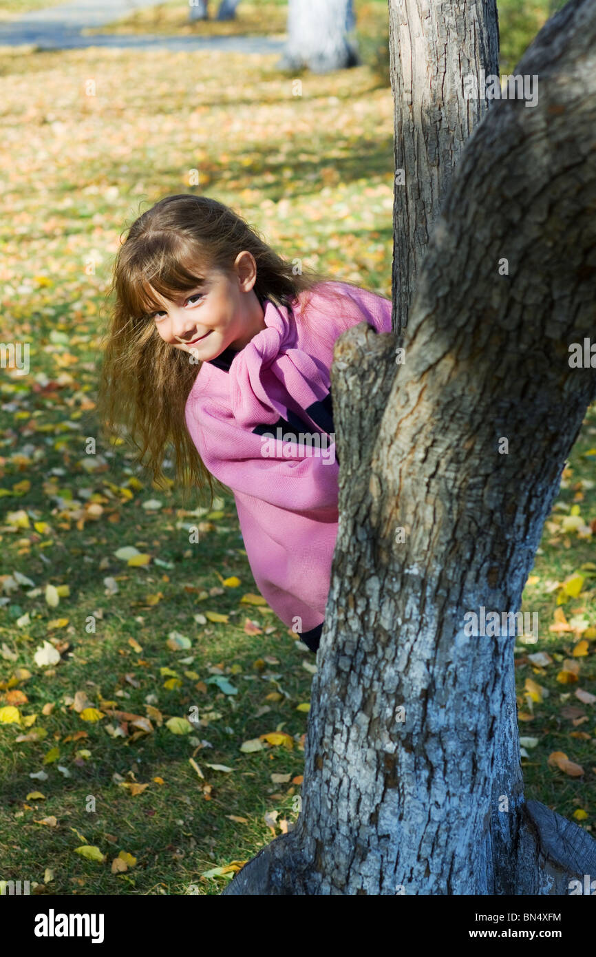 Happy little girl playing in the park Stock Photo - Alamy
