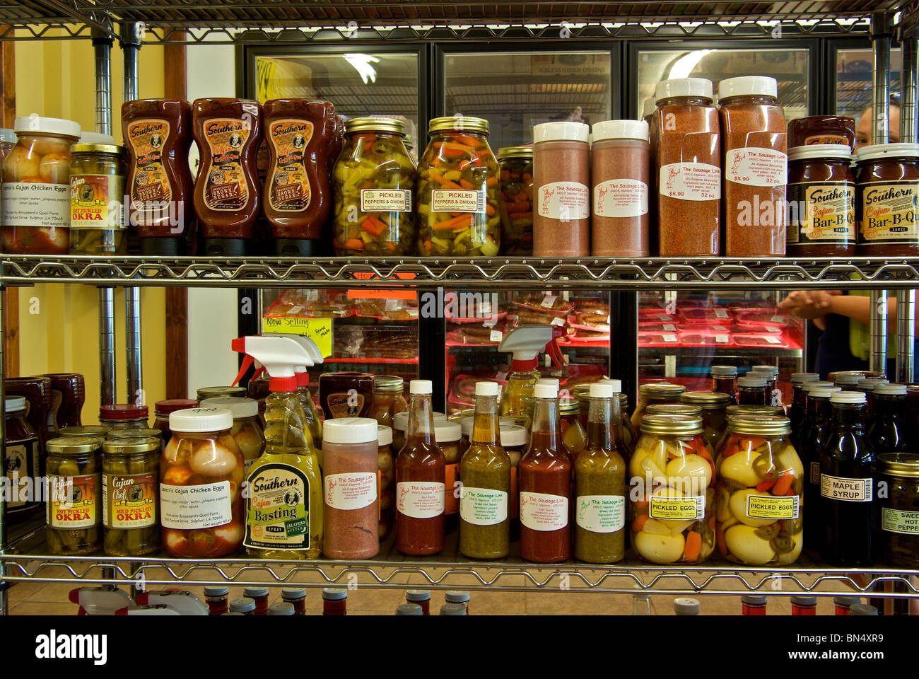 Store shelves of spices pickles condiments barbecue sauces at The