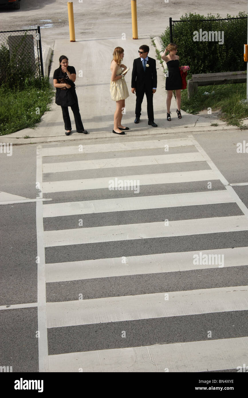 people waiting cross road crosswalk Stock Photo