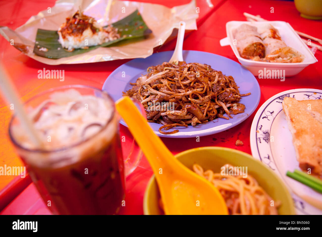 Chinese Malay street hawker food - Nyonya Kuih Pie Tee Hats, Char Kuey Teow, Popia, Curry Laksa , Kaya Toast, Hainanese Coffee Stock Photo