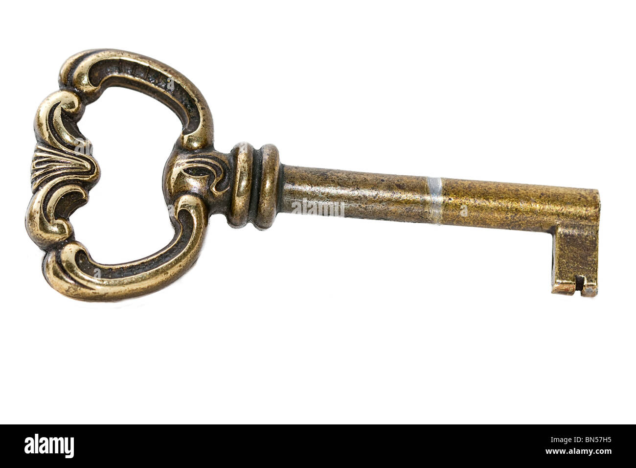 closeup of one used key on white background Stock Photo - Alamy