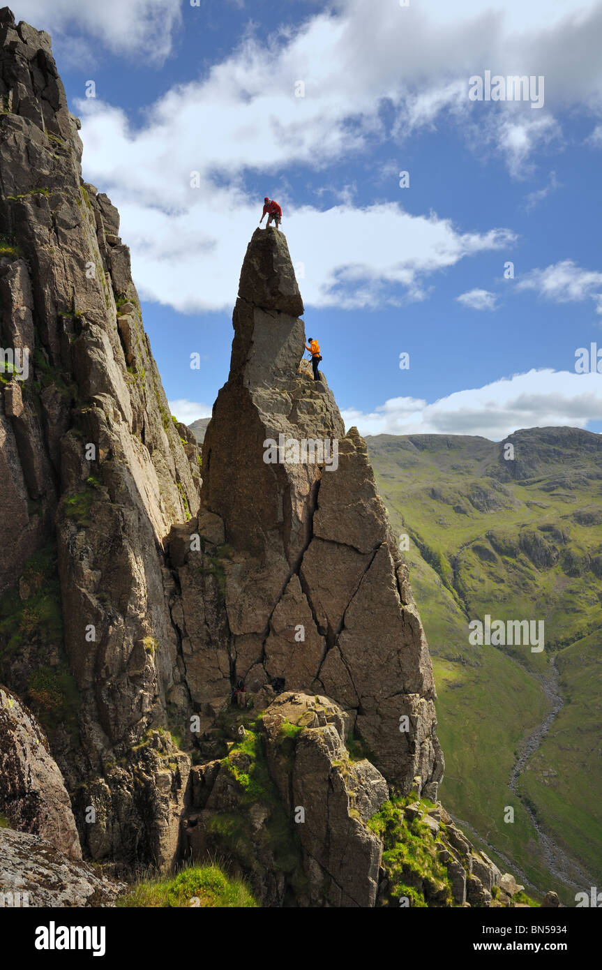 Two climbers on the Napes Needle Great Gable in the Lake District Stock