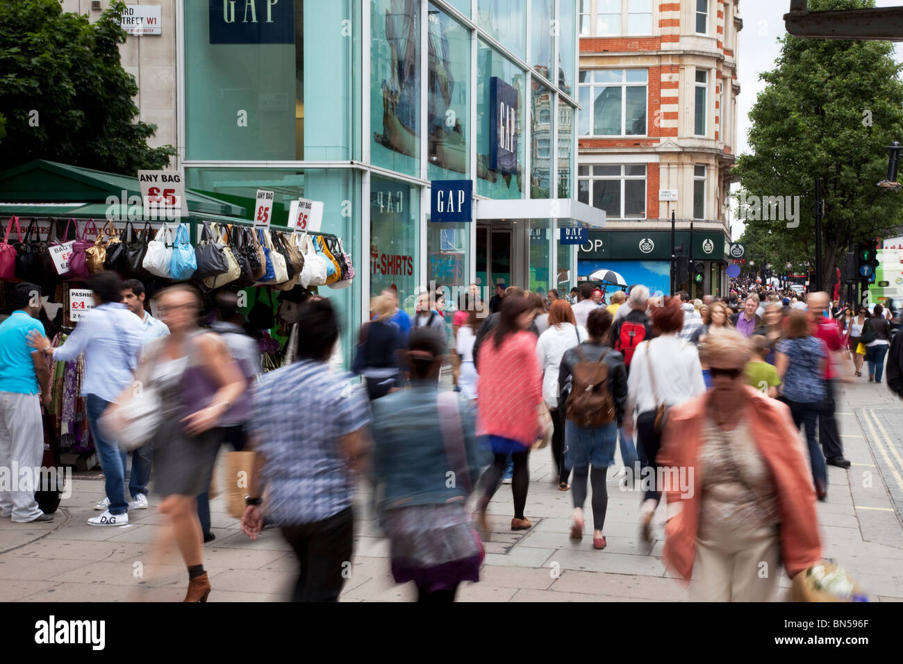 Shoppers on Oxford Street in central London. This is the busiest shopping district in the capital. Stock Photo