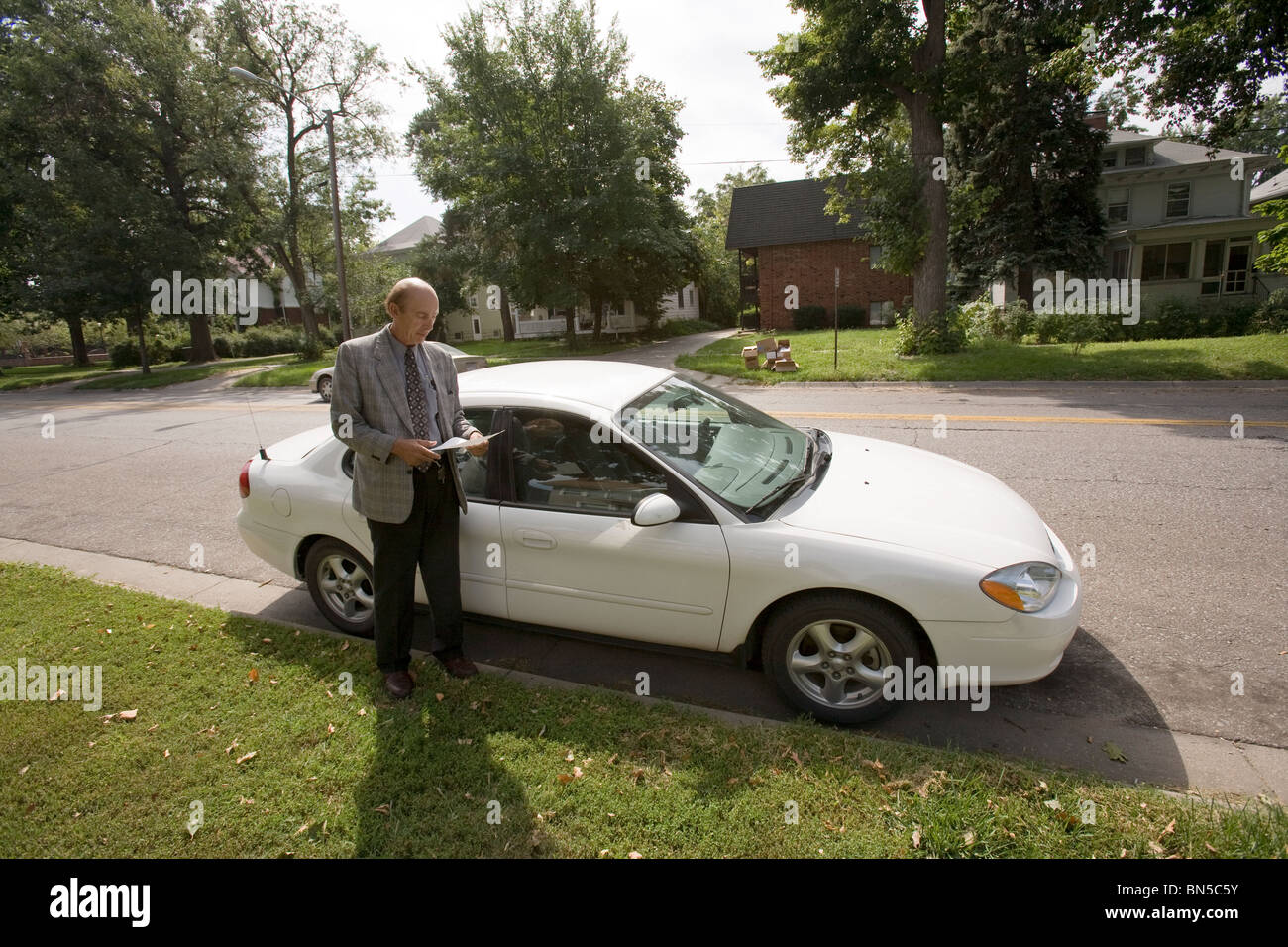 Parole officer in the field preparing to make a housecall at the