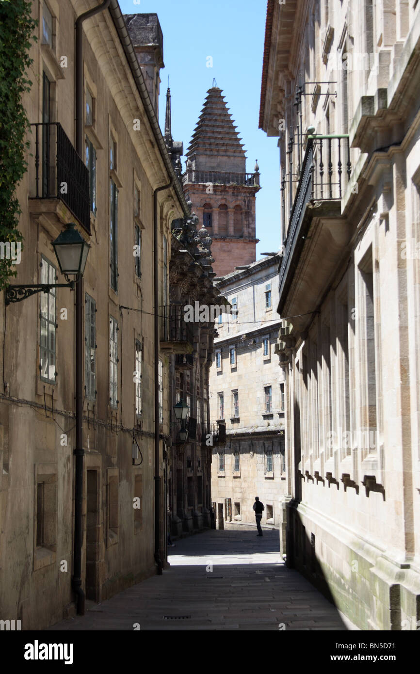 Alleyway with balconies and single figure, Rua de Galmirez, Santiago de Compostella, Galicia, Spain Stock Photo