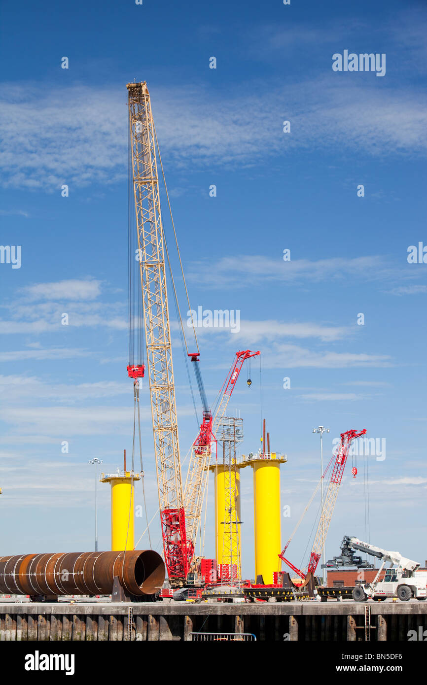 Manufacturing the foundations for off shore wind turbines, at Dong Energy's site in BArrow in Furness, Cumbria, UK. Stock Photo
