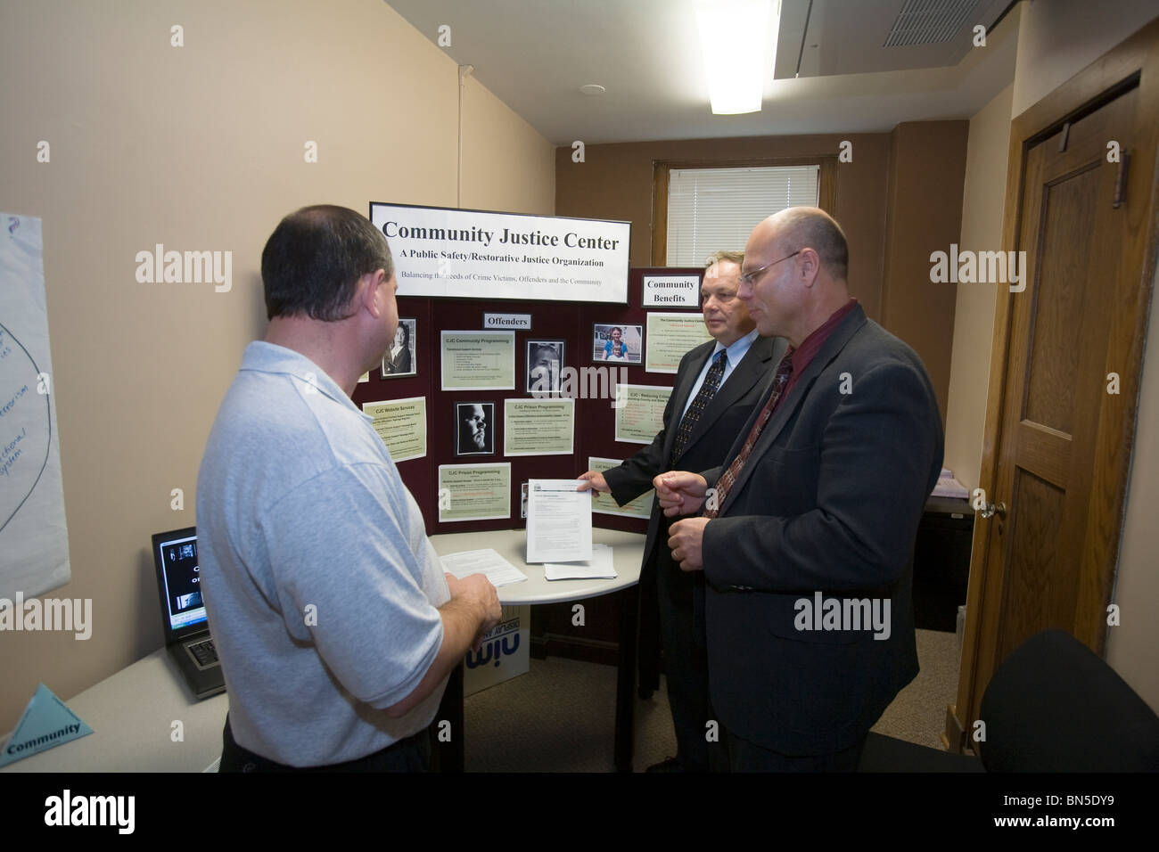 Parole officers talking at job fair site. Nebraska Adult Parole, Lincoln, Nebraska, USA. Stock Photo