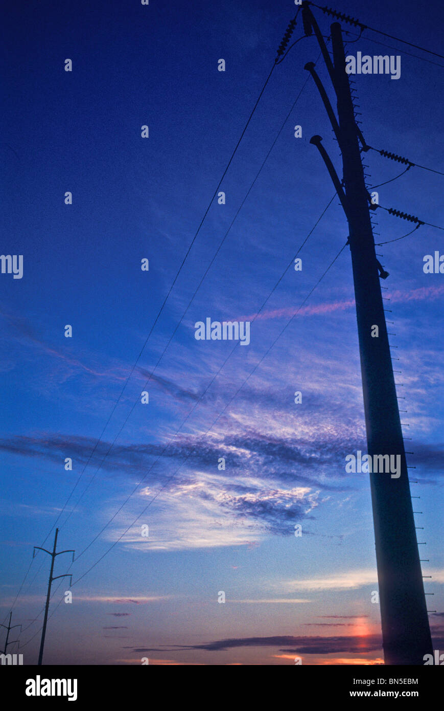 Late afternoon sky electric utility industrial power grid Stock Photo
