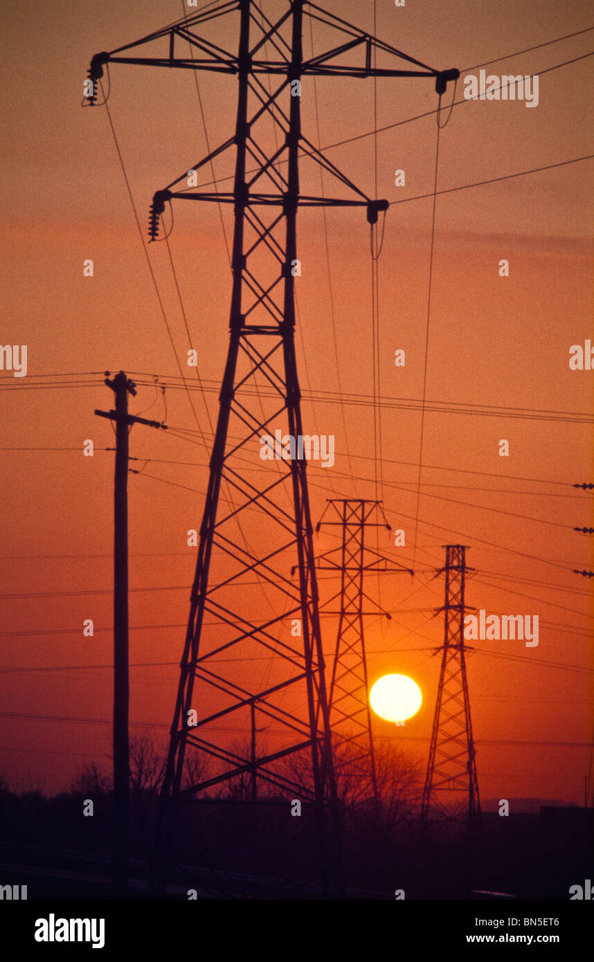 Setting sun sunset industrial electrical industrial power lines Stock Photo Alamy