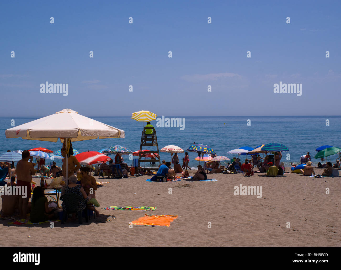 Crowded beach in summer parasols umbrellas hi-res stock photography and  images - Alamy