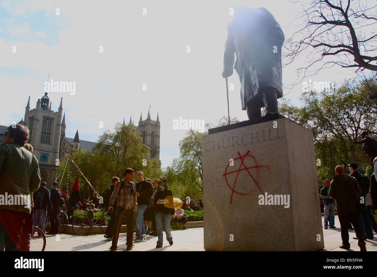 A statue of Winston Churchill is defaced with the Anarchy symbol during the May Day protests 2010 Stock Photo