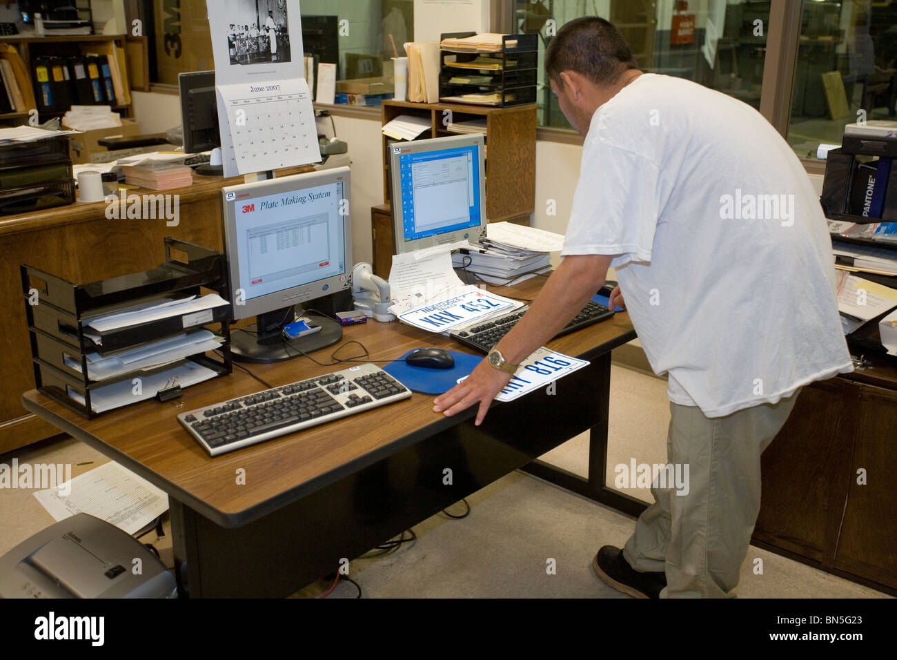Inmate working in the license plate shop at the Nebraska State Penitentiary, a maximum security