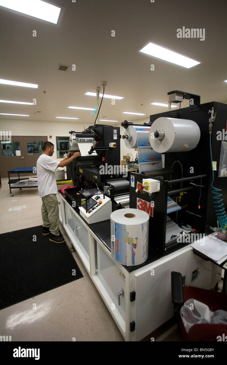 Inmate working in the license plate shop at the Nebraska State Penitentiary, a maximum security