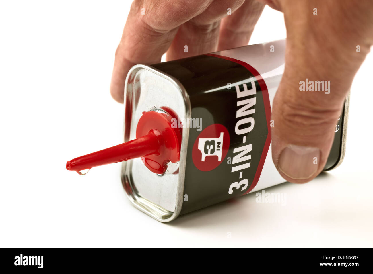 Oiling with a can of '3 in 1 'oil Stock Photo