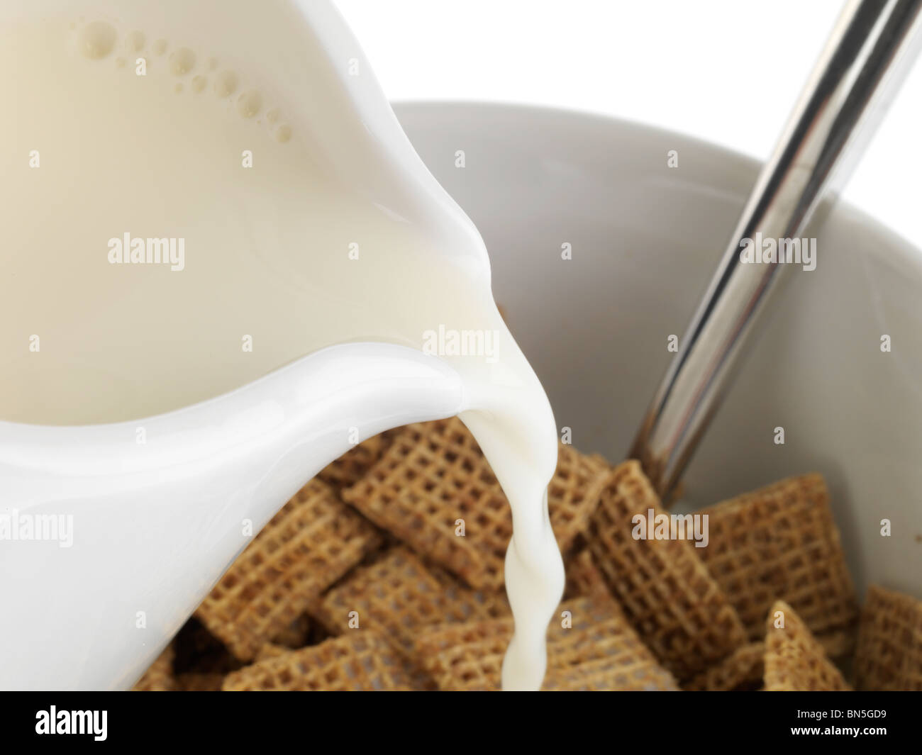 Pouring Milk onto Cereal Stock Photo