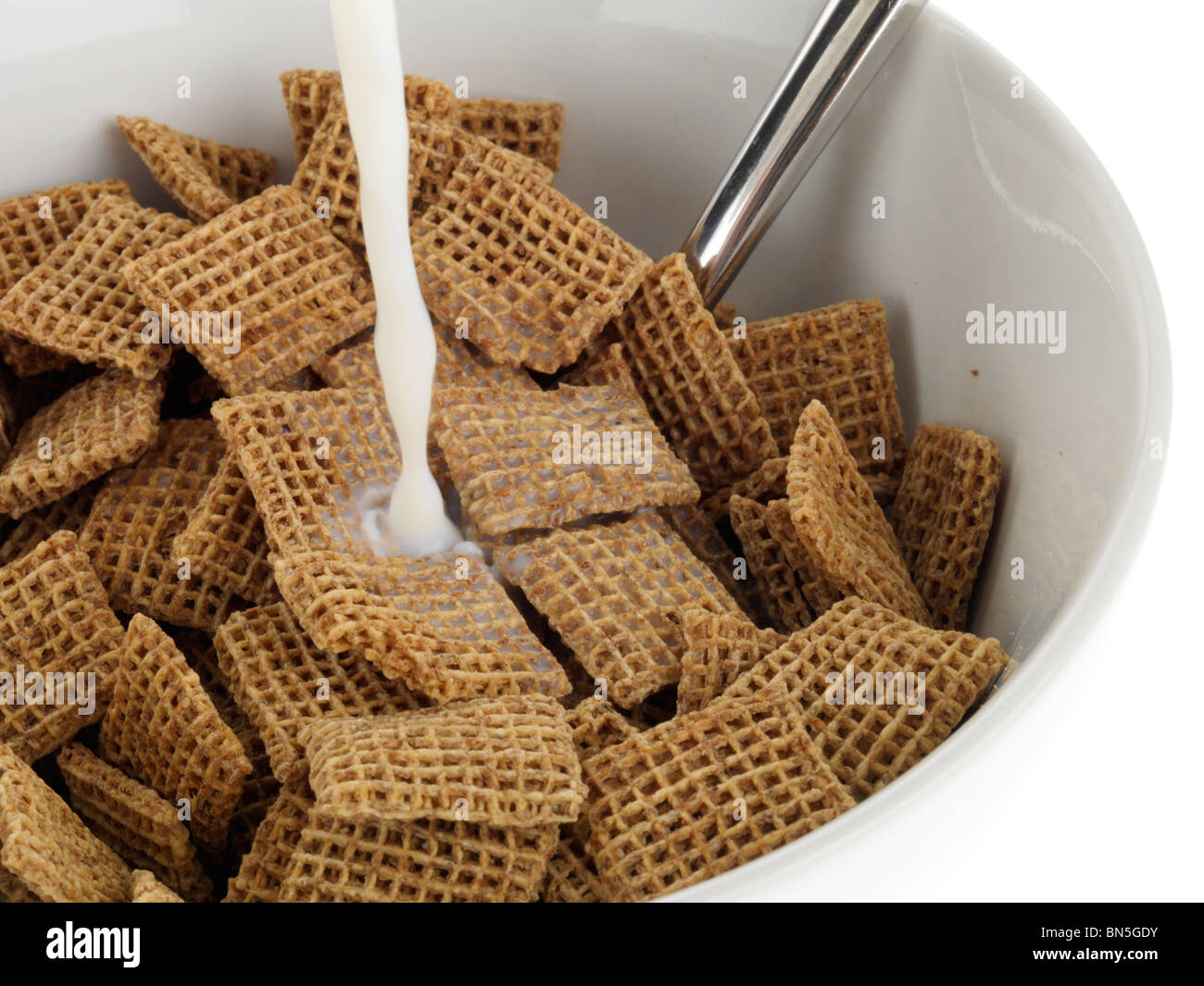 Pouring Milk onto Cereal Stock Photo Alamy