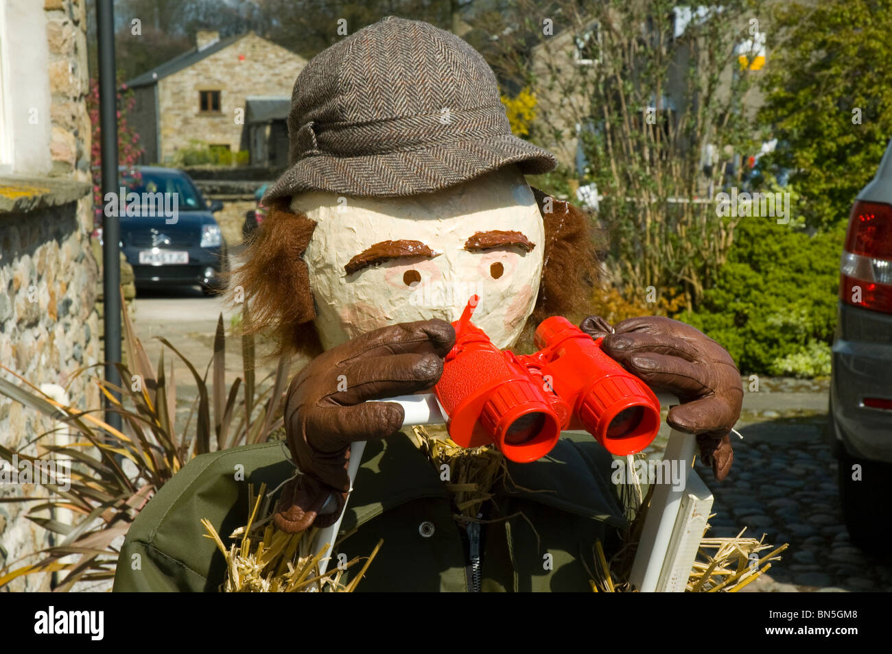 Bird watcher.  An exhibit at the Wray Scarecrow Festival, in the village of Wray, near Lancaster, England, UK Stock Photo