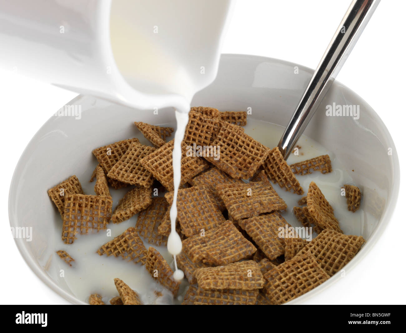 Pouring Milk onto Cereal Stock Photo