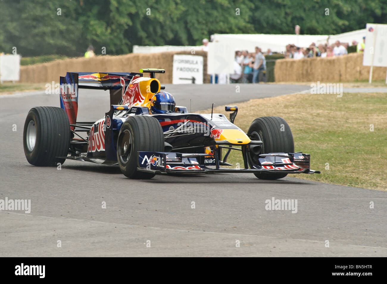 A Red Bull Formula 1 Car Climbs The Hill At Goodwood Festival Of Speed 2010