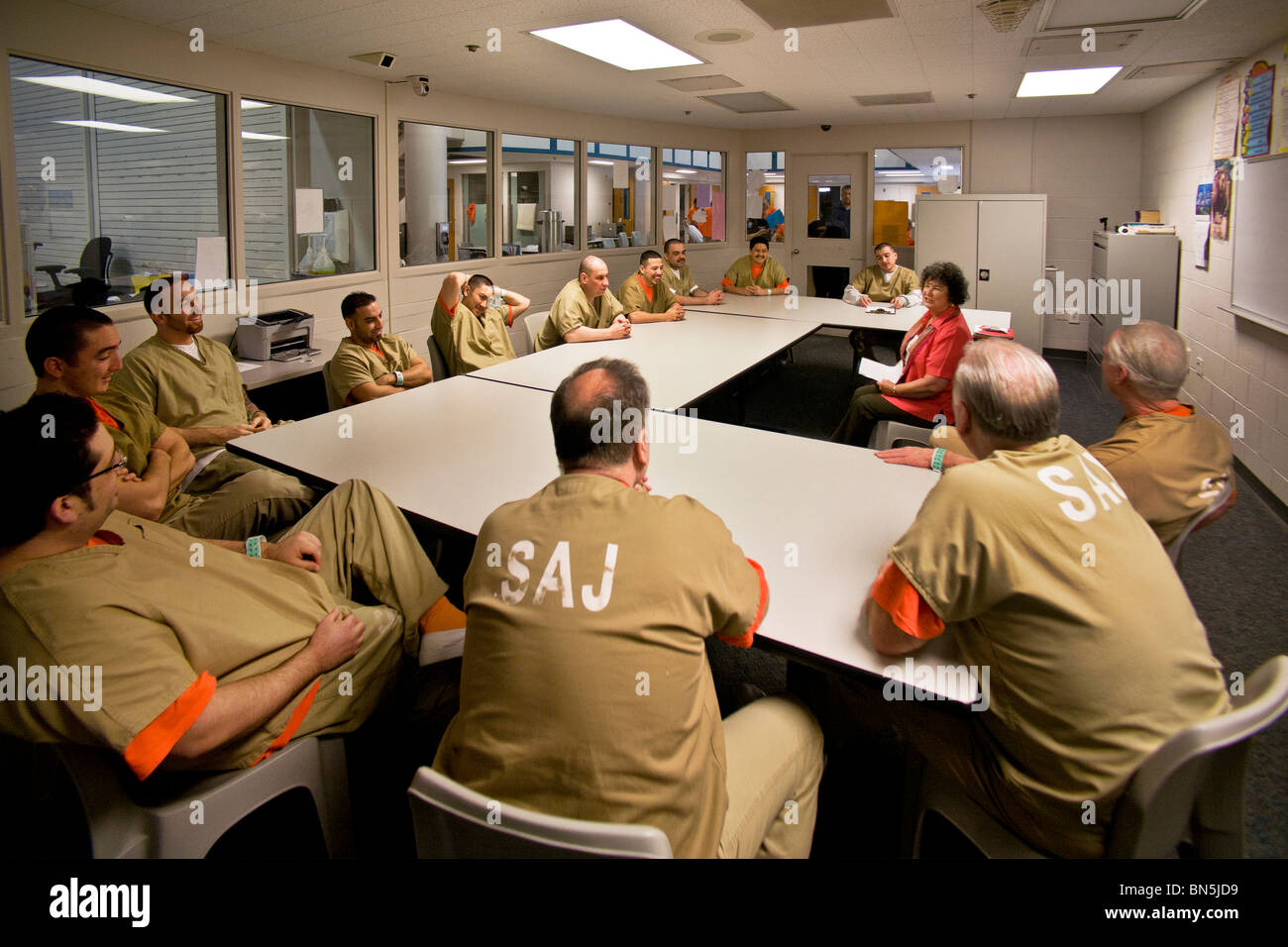 An civilian instructor conducts an anger management class with inmates of the Santa Ana, CA, city jail. MODEL RELEASE Stock Photo