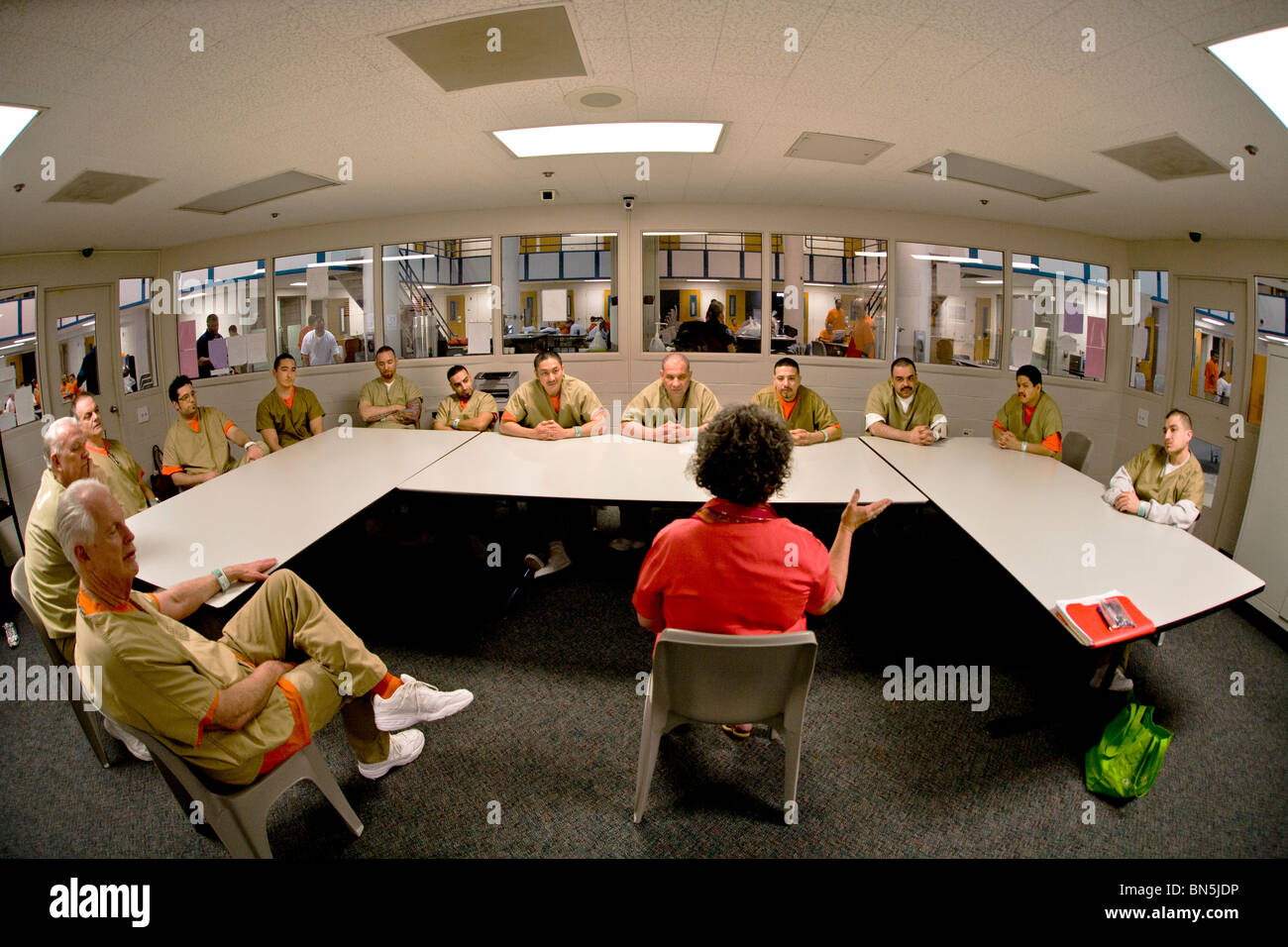 An civilian instructor conducts an anger management class with inmates of the Santa Ana, CA, city jail. MODEL RELEASE Stock Photo