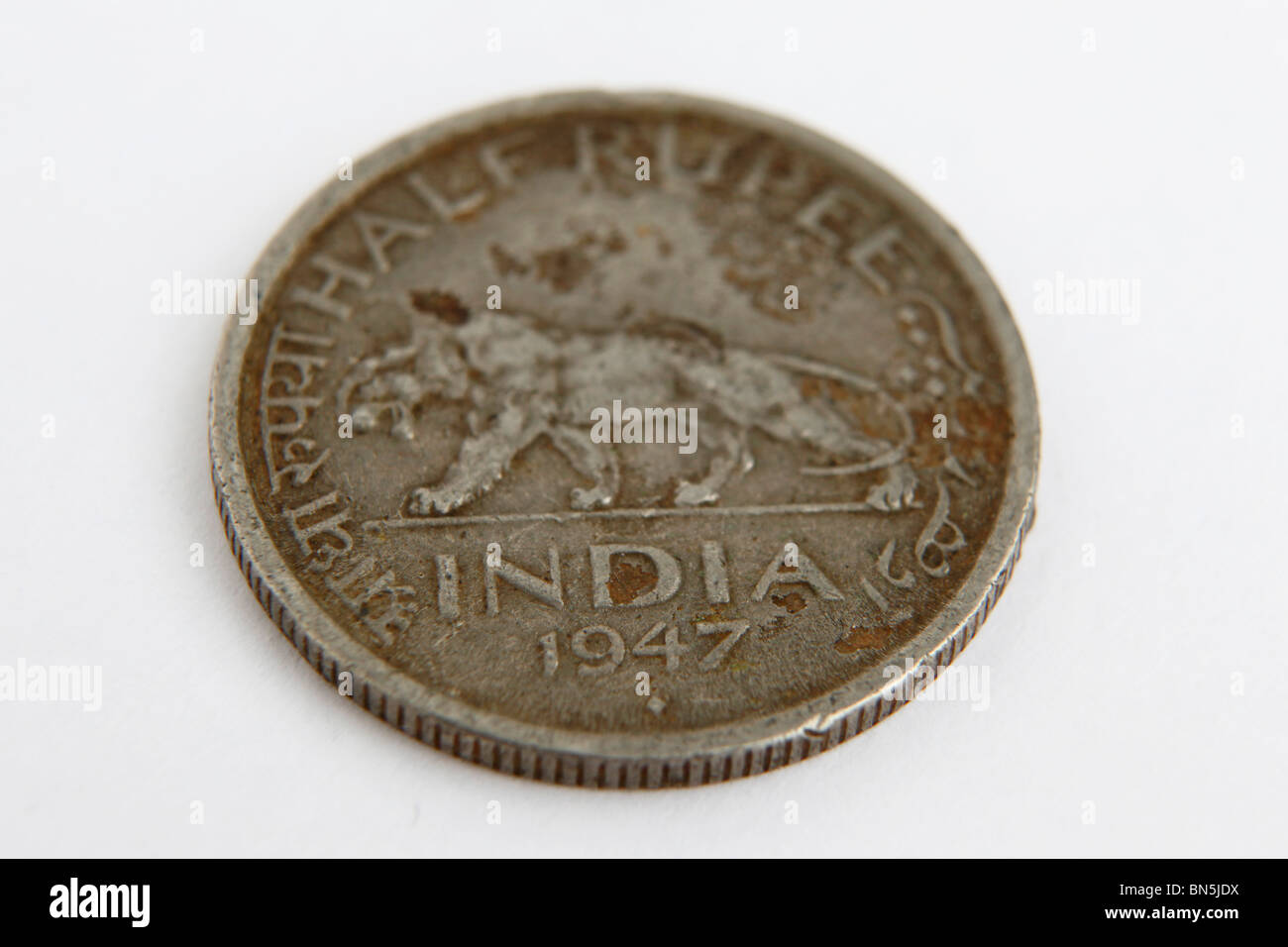 A half rupee Indian coin dates to 1947, the year of Indian Independence. Stock Photo