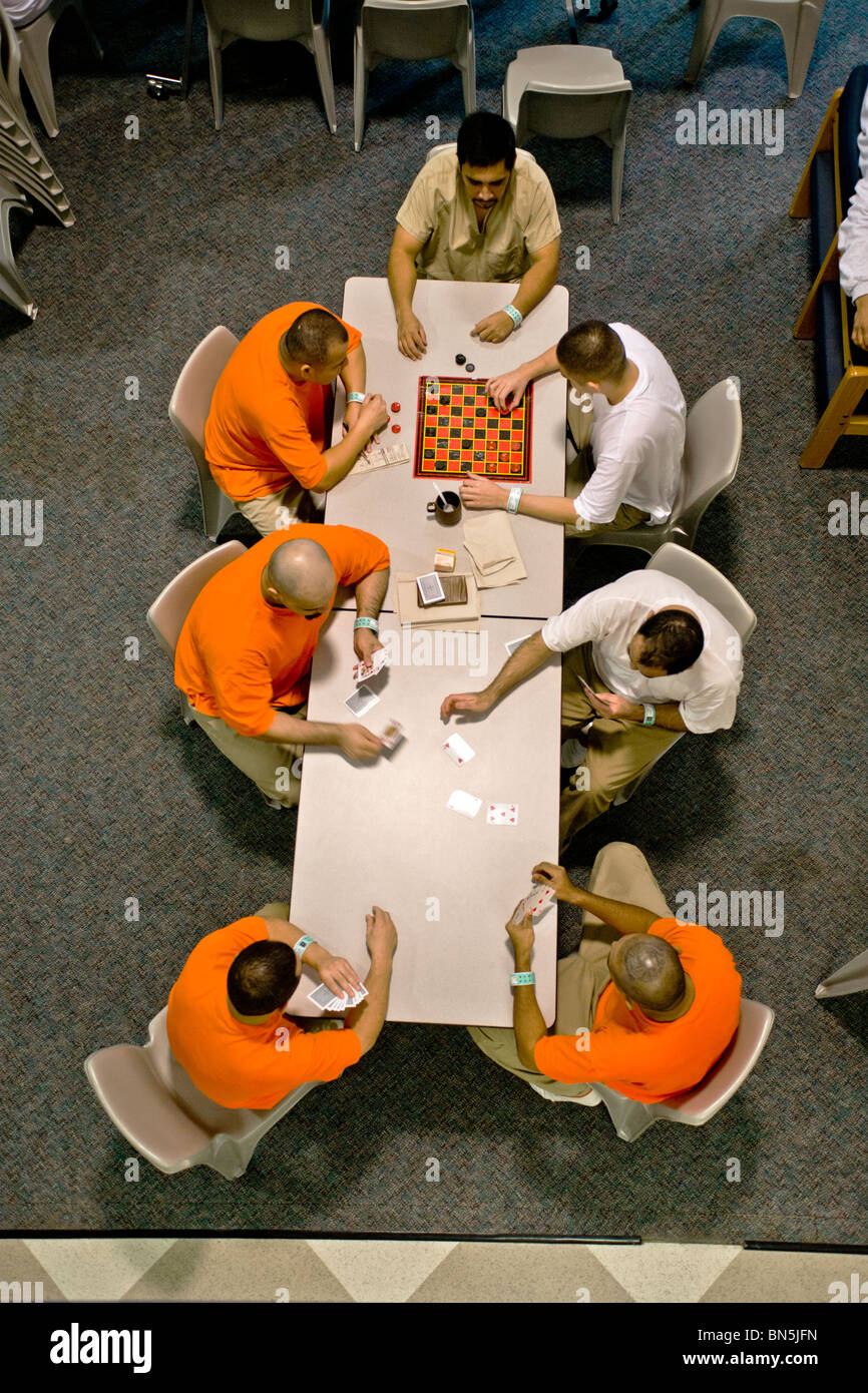 Inmates play pass the time playing games on the table of a cell block  dayroom of the Santa Ana, CA, city jail. MODEL RELEASE Stock Photo - Alamy