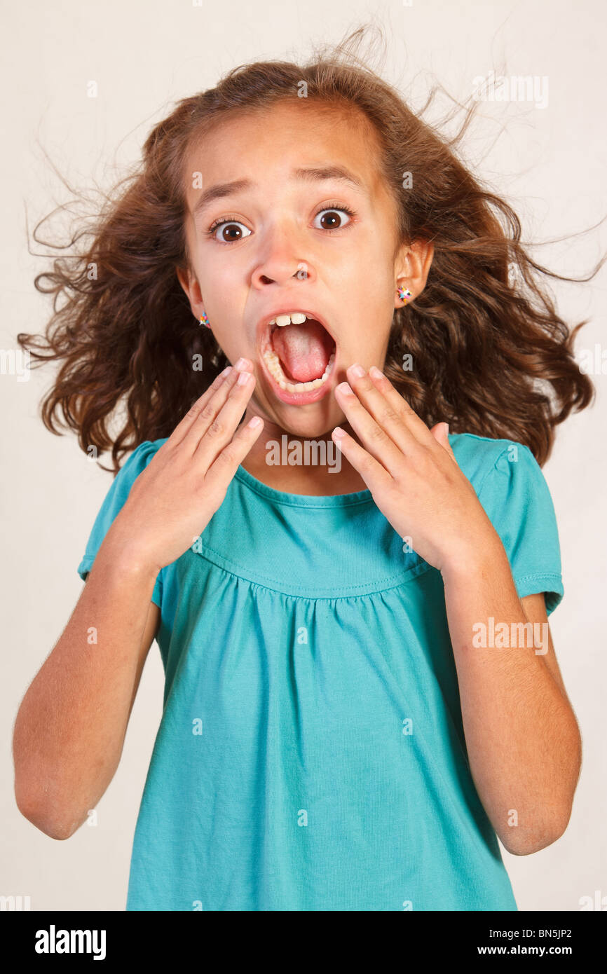 Cute Latina Girl with shocked face Stock Photo