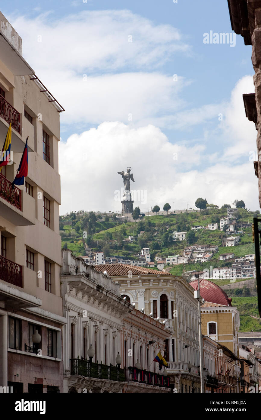 Virgen del Panecillo on hill with building in Quito Ecuador Stock Photo