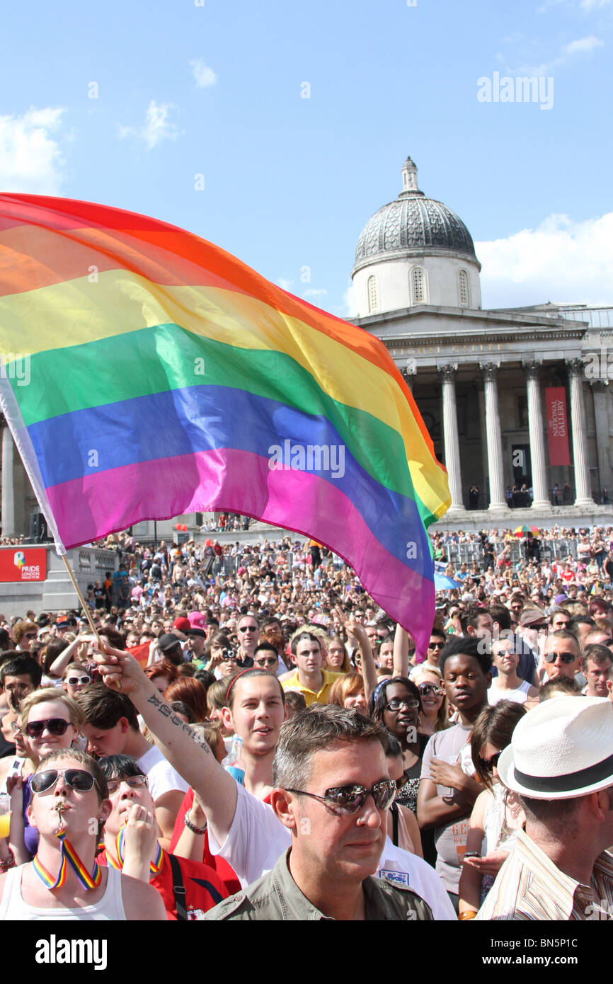 Rainbow flag and crowd in Trafalgar Square at the 40th Anniversary of Pride - Gay Pride Parade in London, 3rd July 2010 Stock Photo