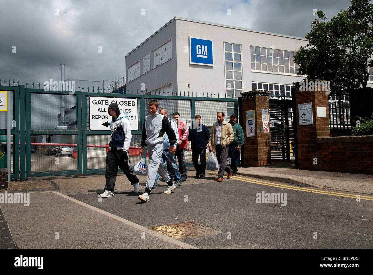 Cleaners leaving the GM Vauxhall factory in Luton, Beds Stock Photo Alamy