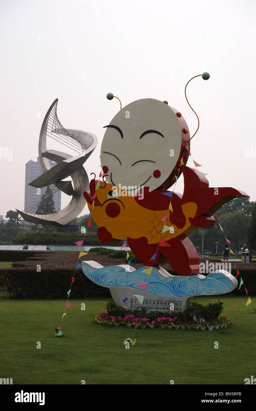 Outdoor sign with fish and sculpture, symbol of abundance, Ningbo city, Zheijang province, China Stock Photo