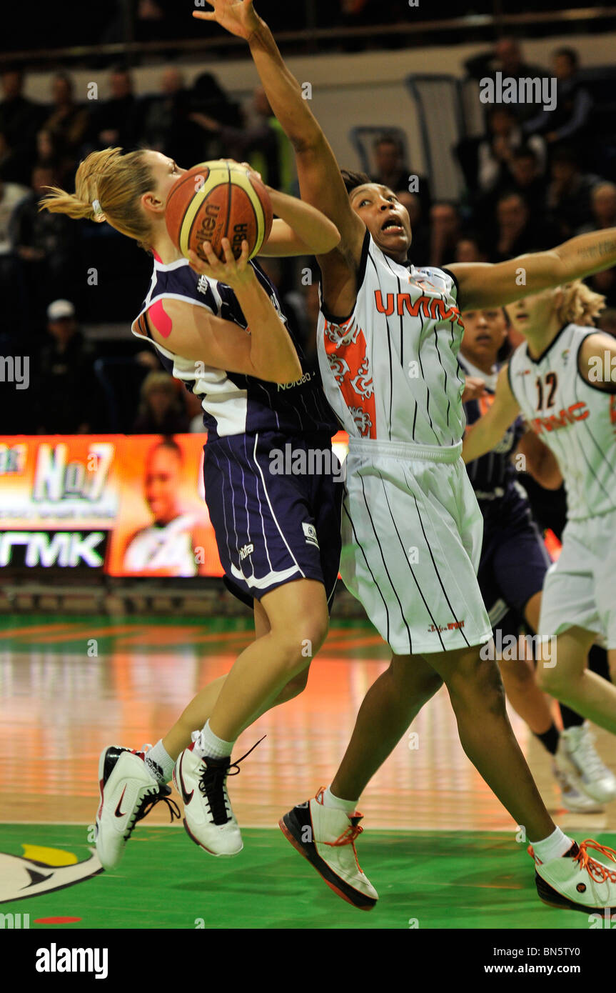 Cappie Pondexter #23 blocks Kristine Karklina #9. Agnieszka BIBRZYCKA #12 and Lyndra Weaver #10 at the background Stock Photo