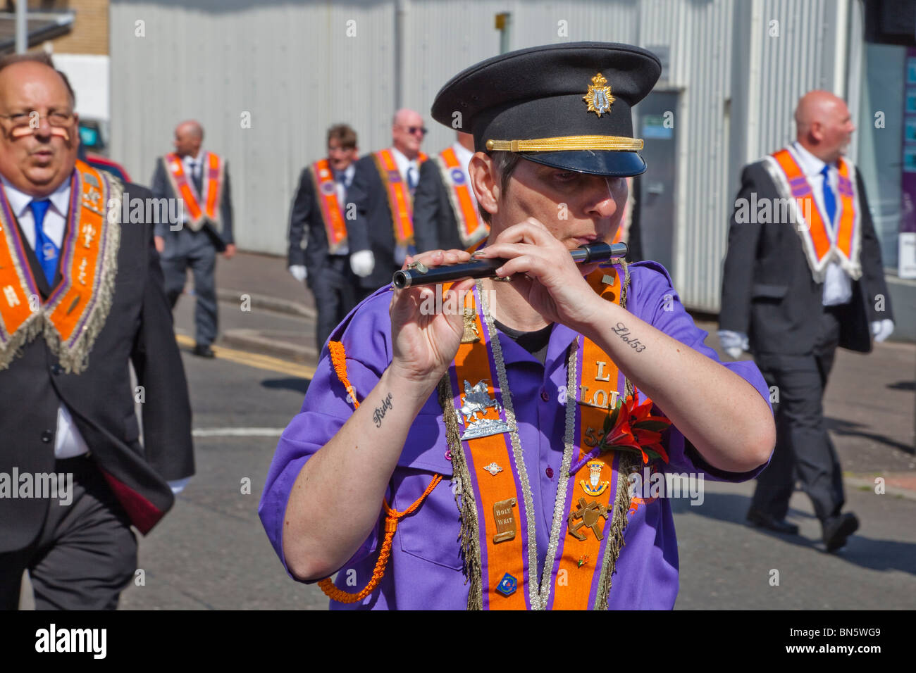 Man playing the flute during an Orange Walk parade, Greenock, Glasgow
