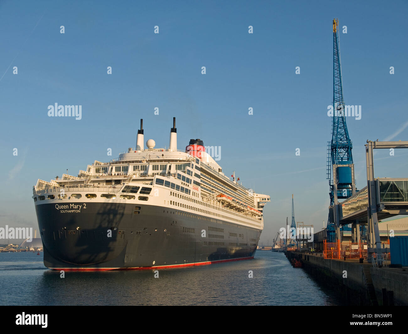 Cunard's ocean liner Queen Mary 2 about to berth early morning at
