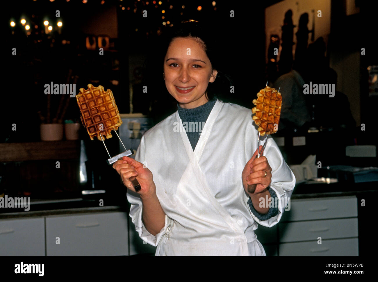 1, one, Belgian woman, cooking waffles, wafels, waffles of Liege, gaufre, gauges, Gaufres de Liege, city of Brussels, Brussels, Belgium, Europe Stock Photo