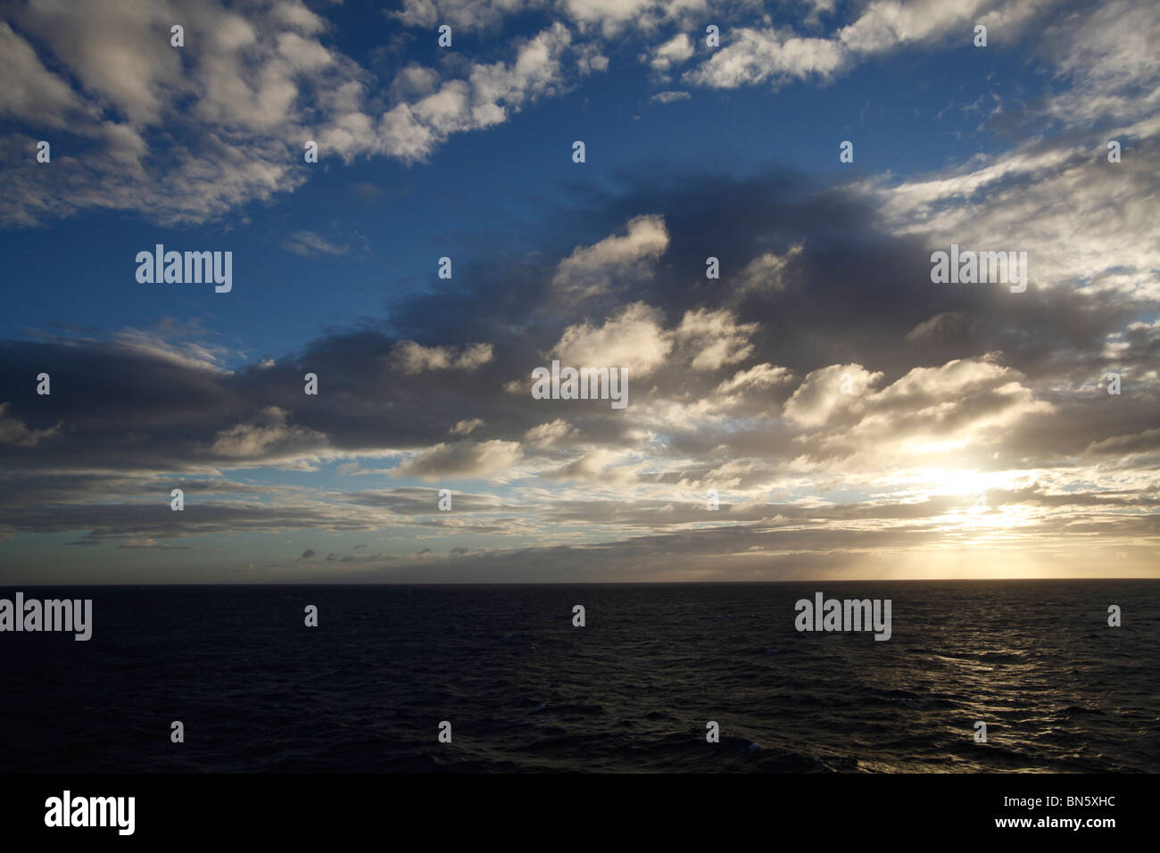 sunset with clouds over the Pacific Ocean Stock Photo - Alamy